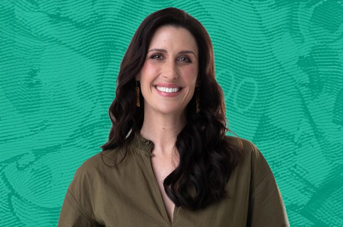 Photo of Nadine Higgins, host of The Prosperity Project podcast on a green background.