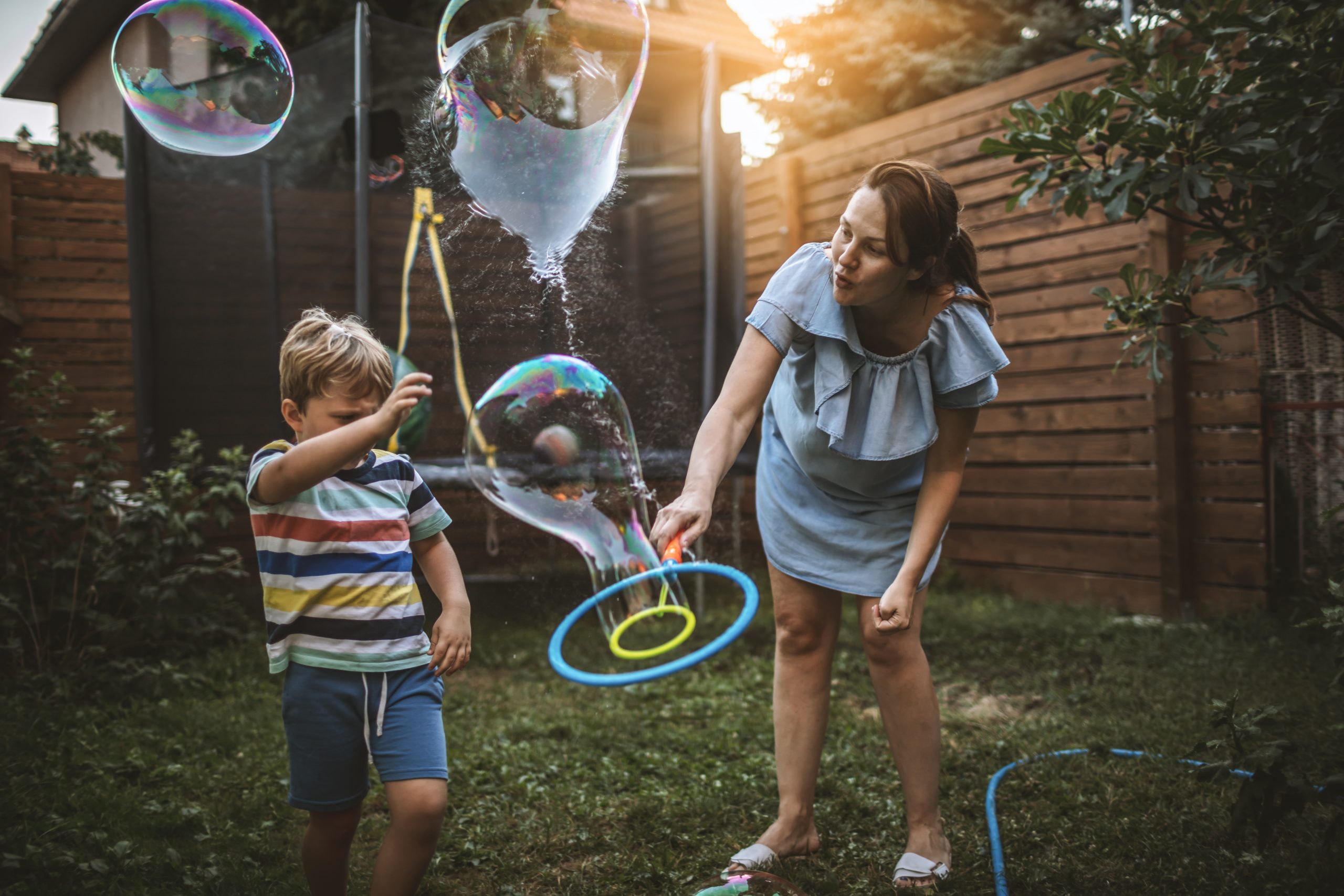 Mother and son playing with bubbles