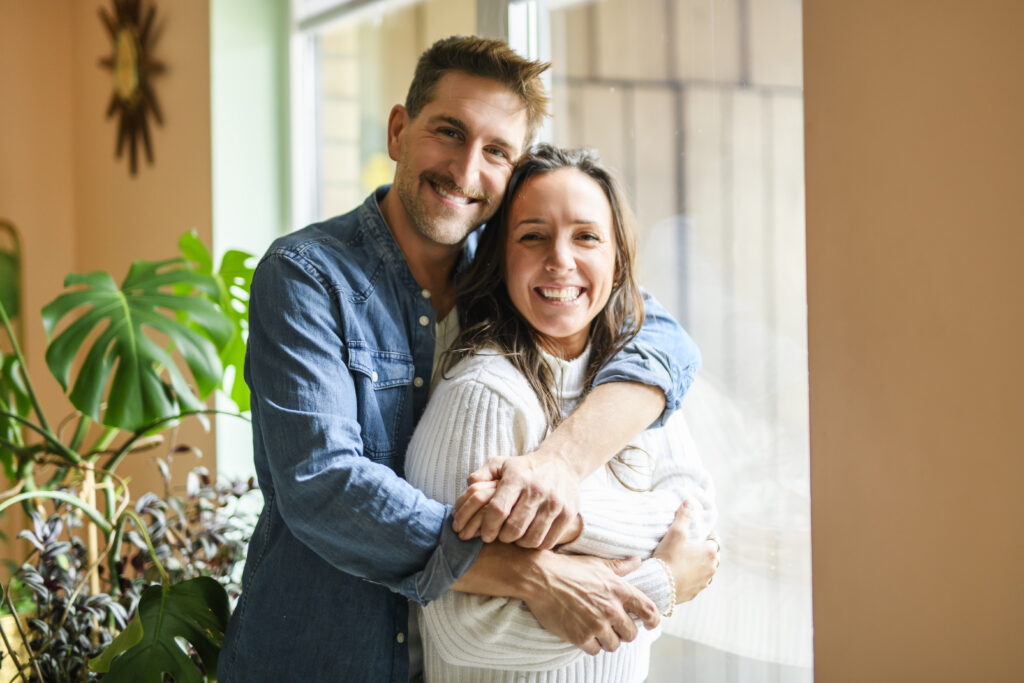 Happy couple in their home
