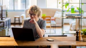 Woman looking at laptop